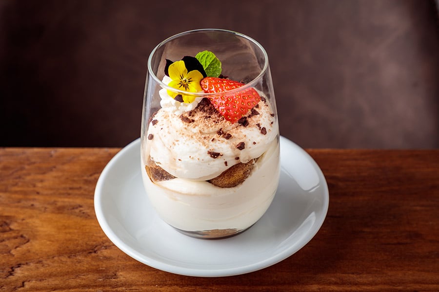 A visually delightful dessert elegantly served in a glass, a perfect blend of flavors and textures.